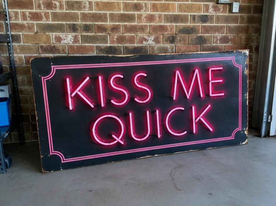 Hand-painted 'Kiss Me Quick' neon sign